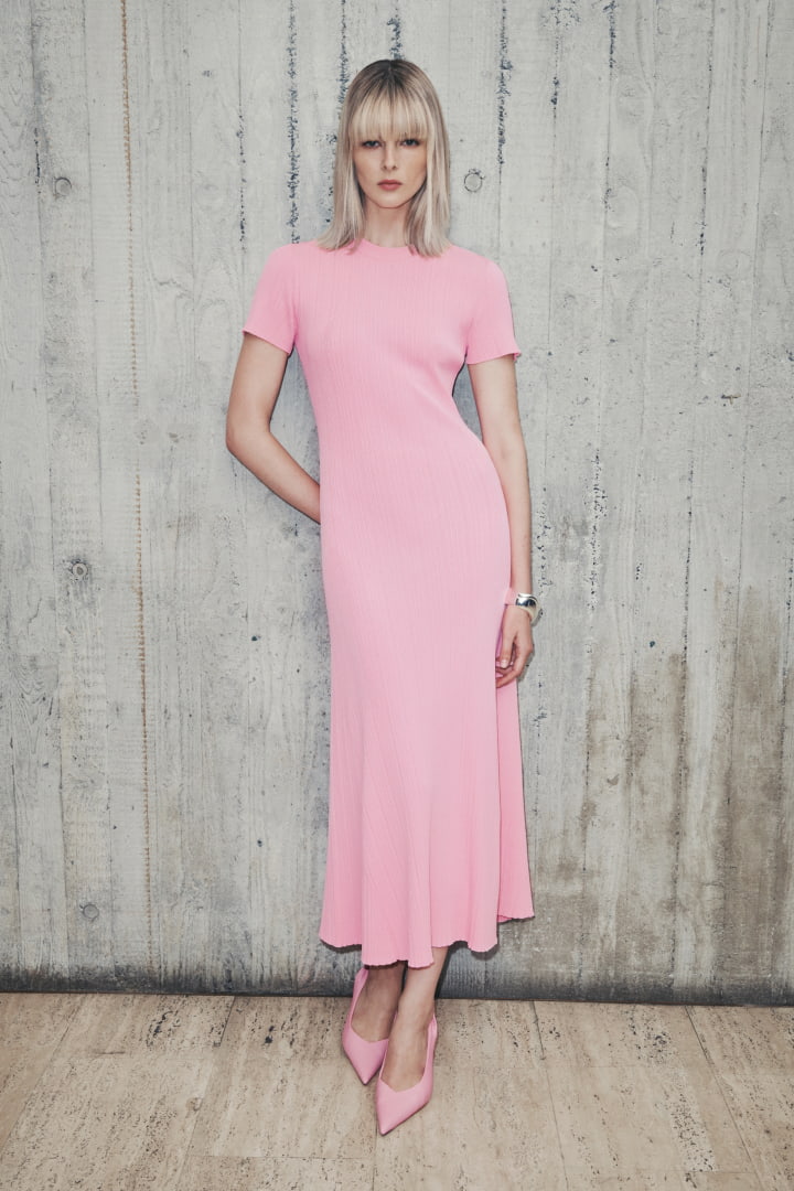 Woman in floss pink variegated short sleeve knit dress, floss pink adriana heel and silver noa cuff