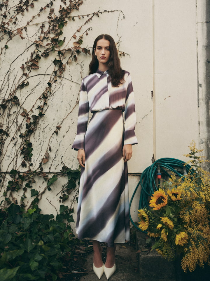 Woman wearing the eclipse blue split maxi shirt dress and lemon scarlett mules