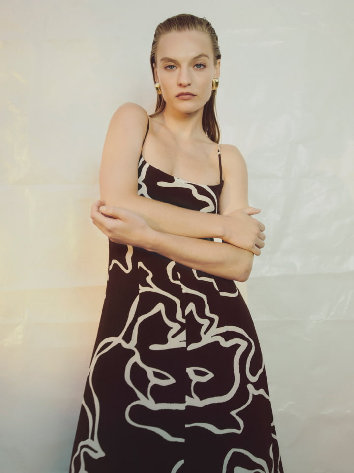 Woman in chocolate gather tier maxi dress